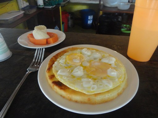 The common Colombian breakfast of arepas (thick corn tortillas) and eggs