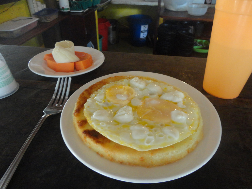 The common Colombian breakfast of arepas (thick corn tortillas) and eggs