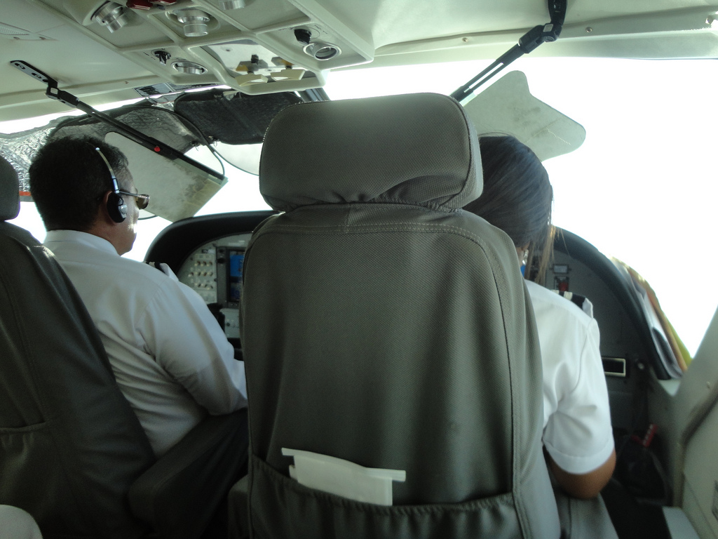 Sitting next to the pilots on the way back from Little Corn